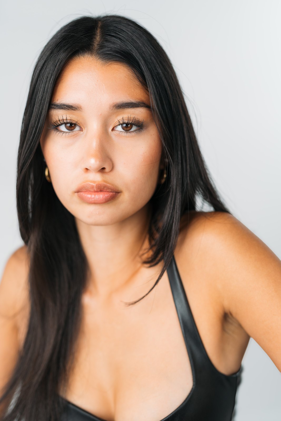 Julia Crofoot in a close studio portrait wearing a black top