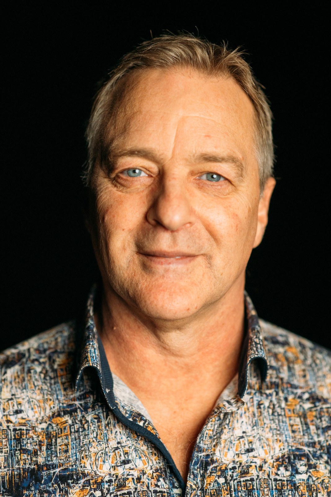 Roark Critchlow in a close portrait wearing a patterned shirt