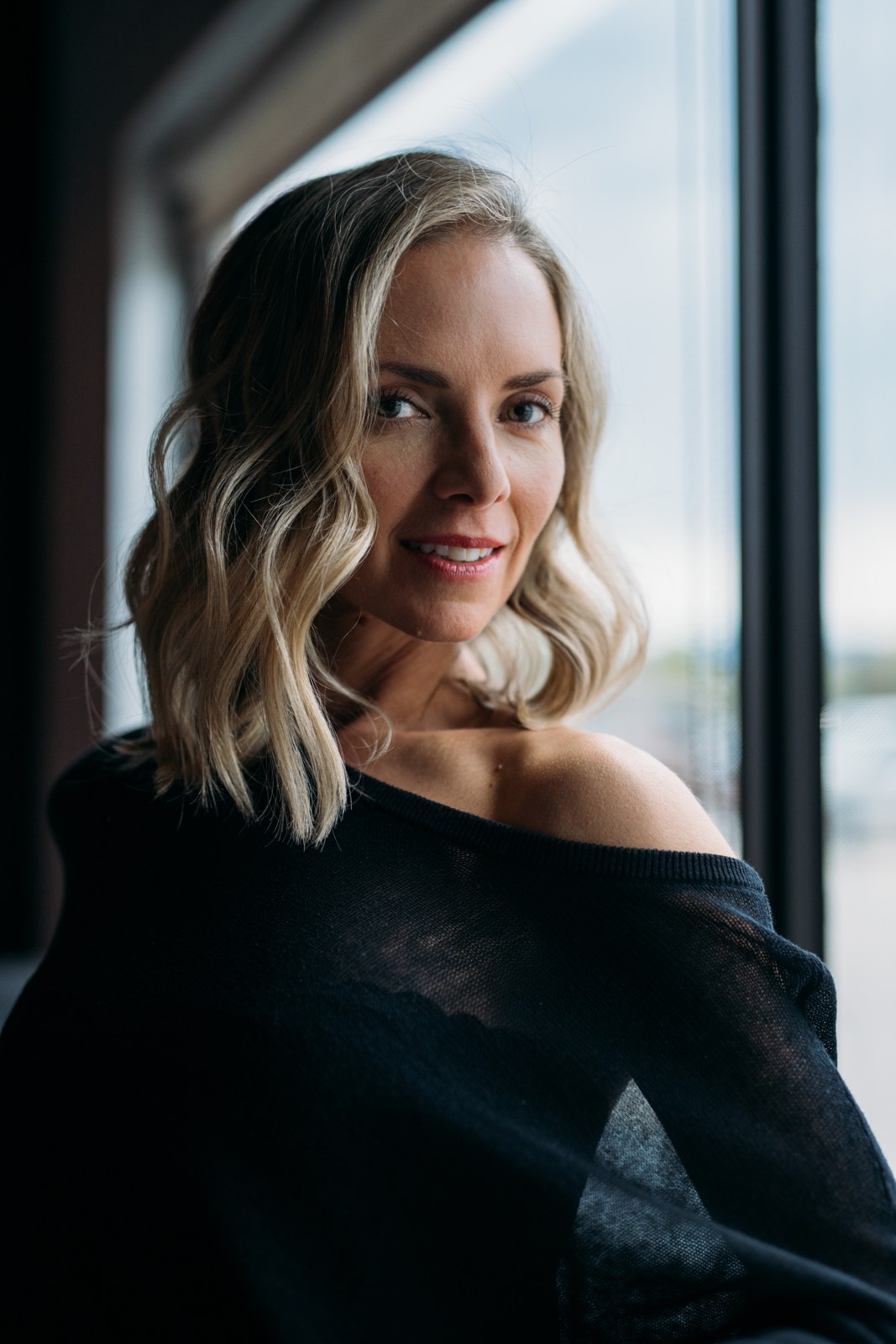 Sarah Smith-Podollan in soft window light, photographed by James Alton
