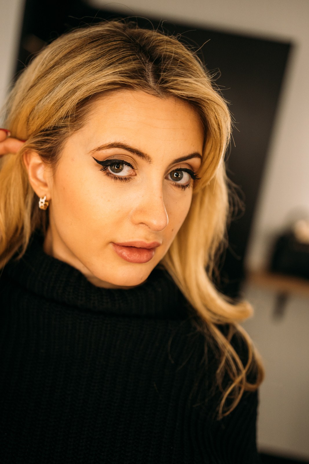 Shanelle Connell in a close studio portrait wearing a black sweater