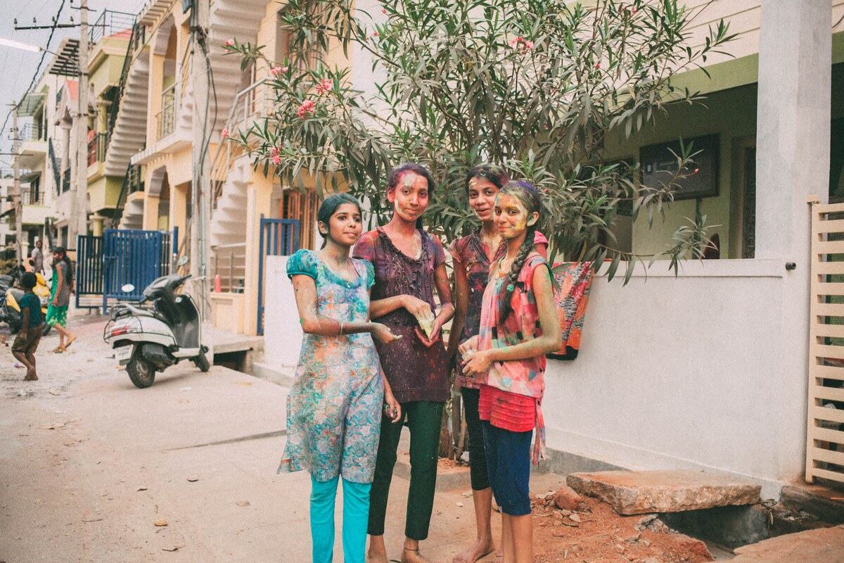 Holi celebration colour moves through the street in Mysore, India. print option