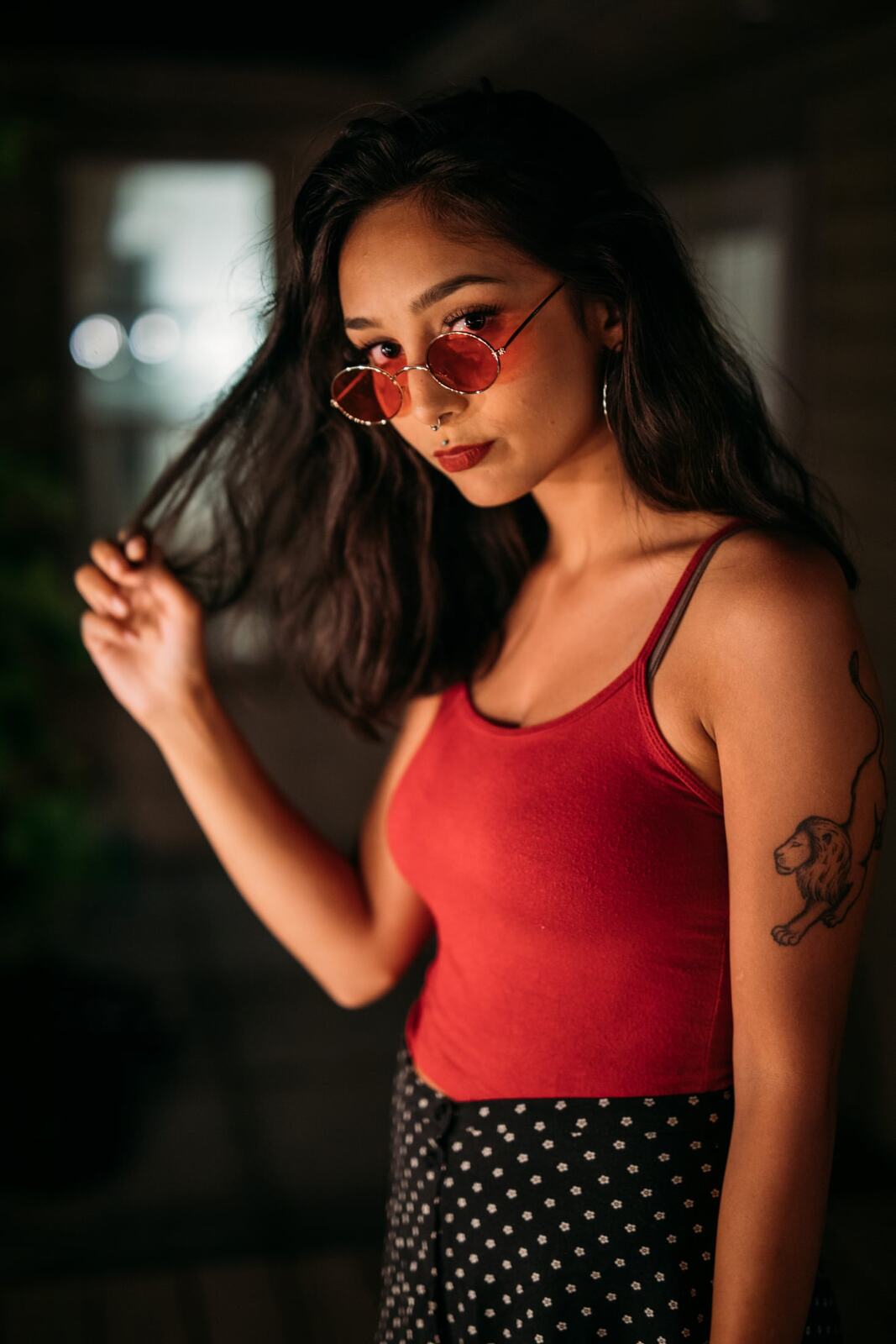 Angelica in Warm Shadow story frame 6: Red sunglasses, warm rooms, deck lights and close portraits from a more intimate portrait session.