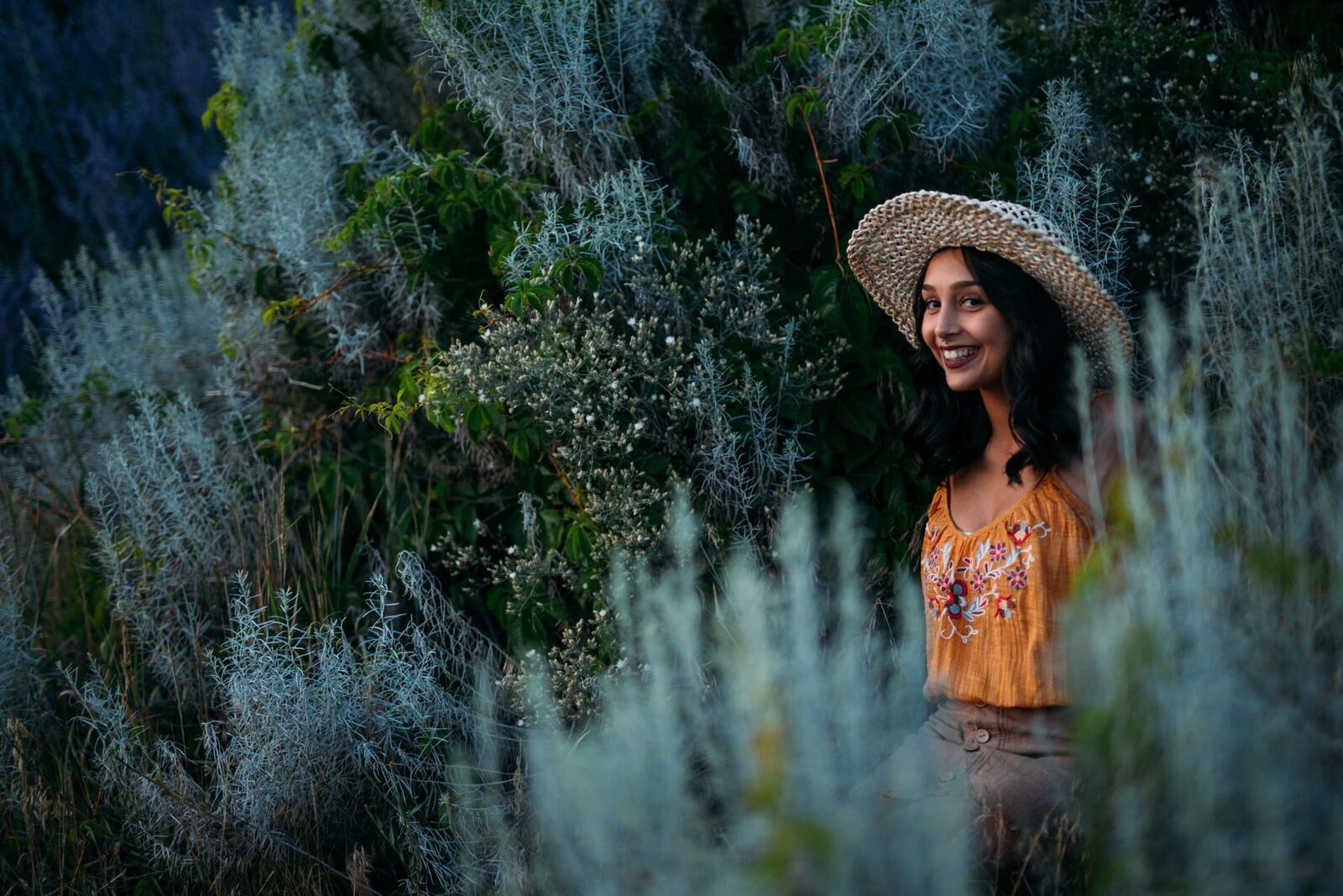 Angelica in Garden Light story frame 7: An earlier portrait story with garden colour, mirror play, straw-hat frames and window light.