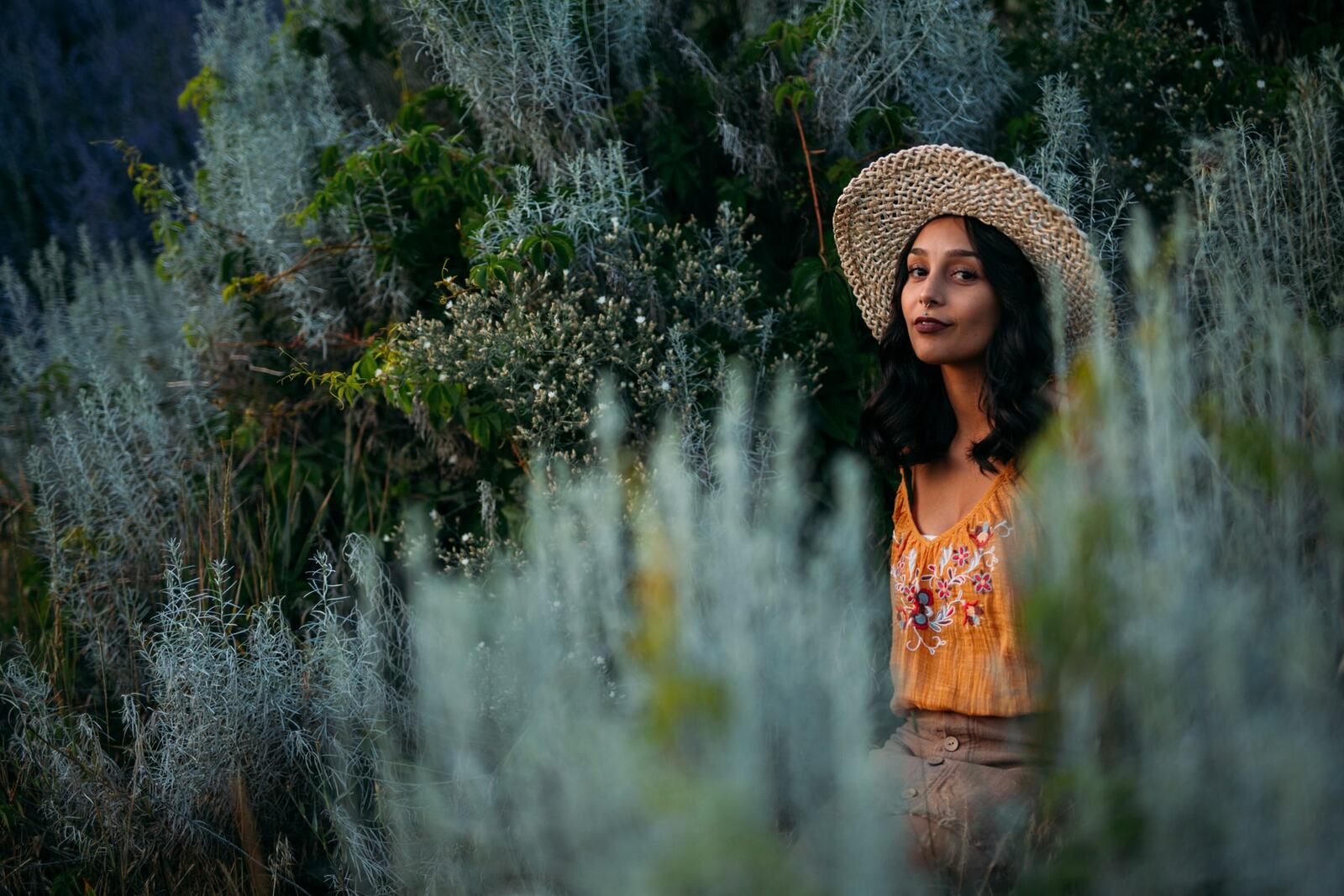 Angelica in Garden Light story frame 8: An earlier portrait story with garden colour, mirror play, straw-hat frames and window light.