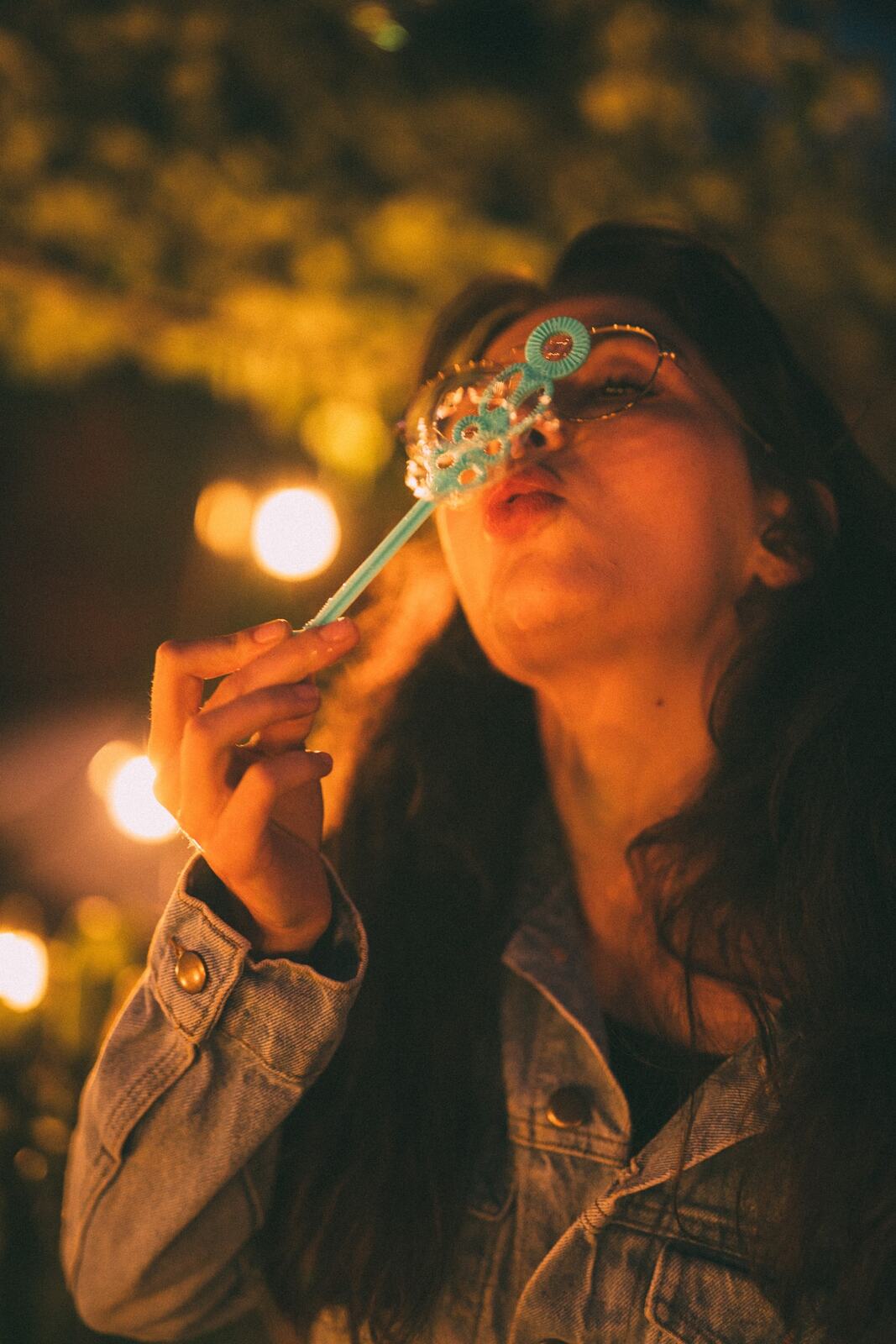 Mel, Summer 2019 story frame 12: A 2019 portrait archive story with bubbles, reeds, glasses and warm dusk colour.