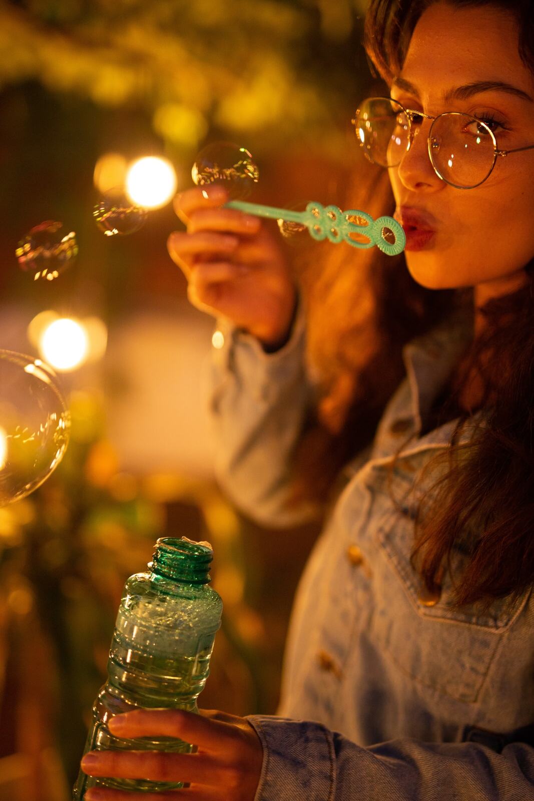 Mel, Summer 2019 story frame 13: A 2019 portrait archive story with bubbles, reeds, glasses and warm dusk colour.