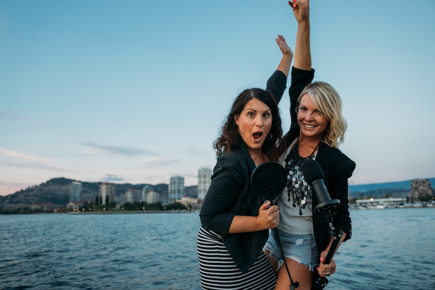 Let's Not Sugarcoat It, Summer corporate story frame 37: A summer business-portrait set for Let's Not Sugarcoat It: docks, colour, boat light and two women making room for conversations that are direct, raw and public..