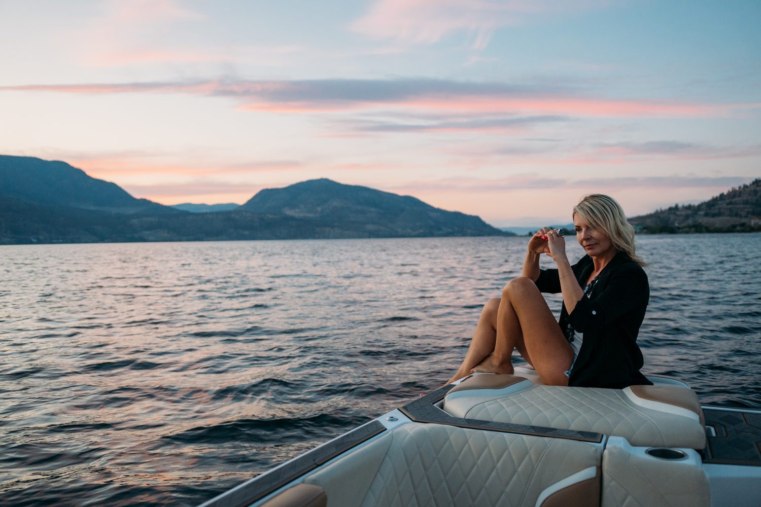Let's Not Sugarcoat It, Summer corporate story frame 40: A summer business-portrait set for Let's Not Sugarcoat It: docks, colour, boat light and two women making room for conversations that are direct, raw and public..