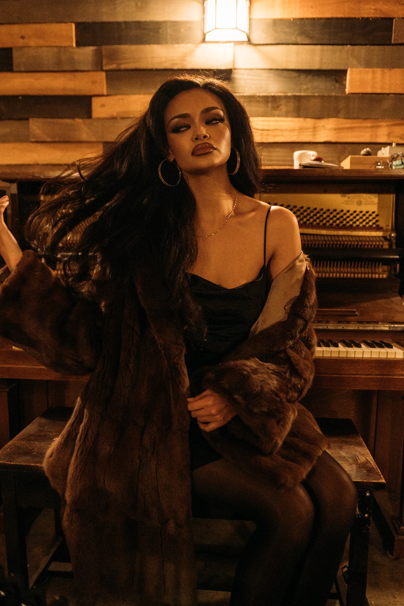 Music Studio Portraits: Quiet seated gaze with the jacket draped around shoulders.