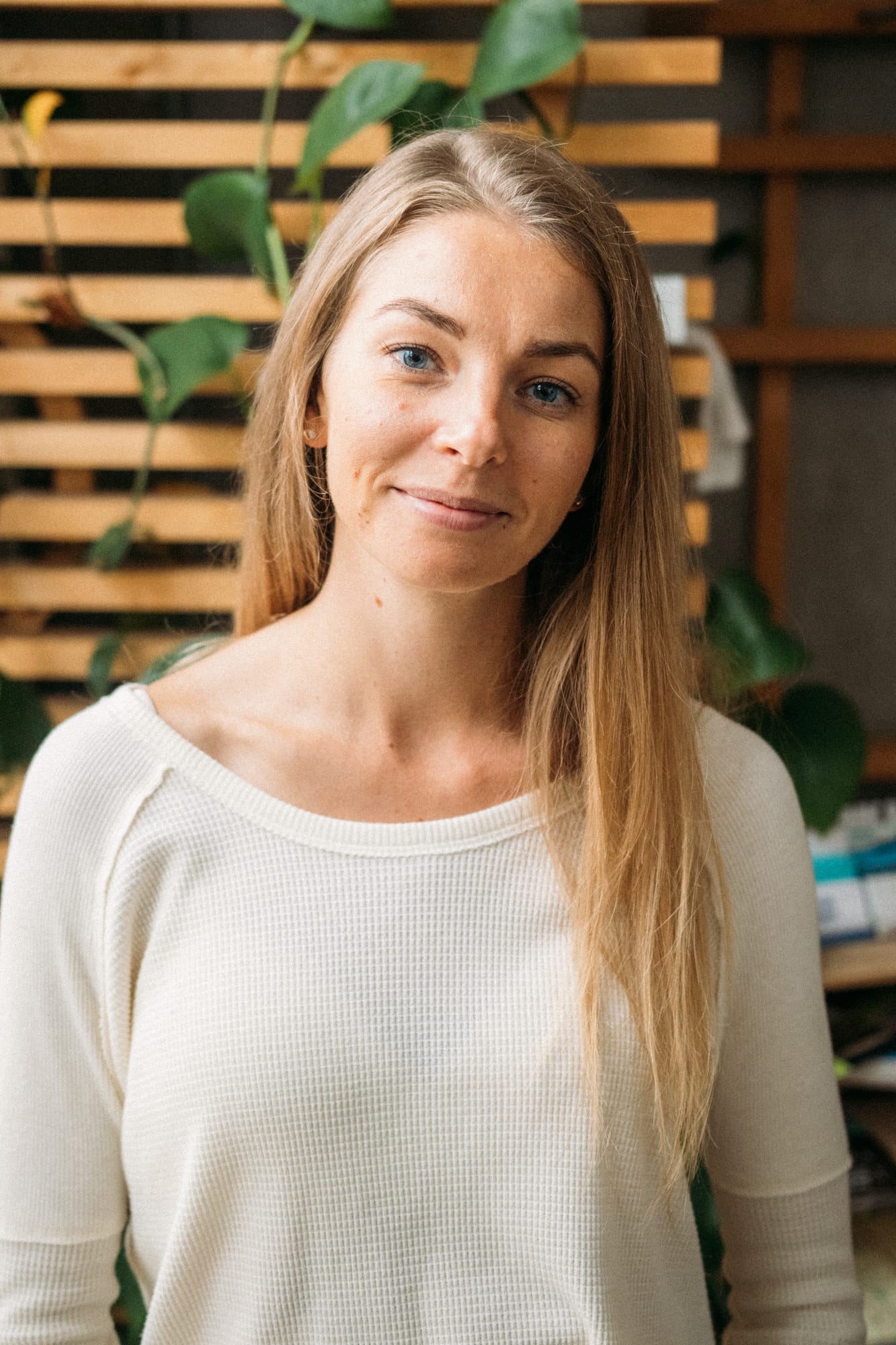 Angela at Float Space portraits story frame 5: A Float Space portrait set that moves from clean wellness headshots into red low-key portraits, skin, shadow and close detail..