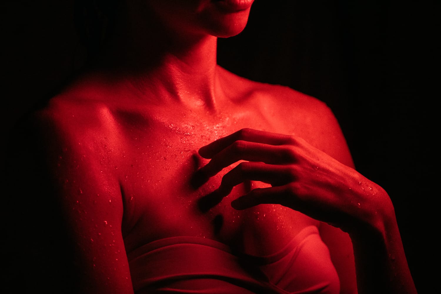 Angela at Float Space portraits story frame 23: A Float Space portrait set that moves from clean wellness headshots into red low-key portraits, skin, shadow and close detail..