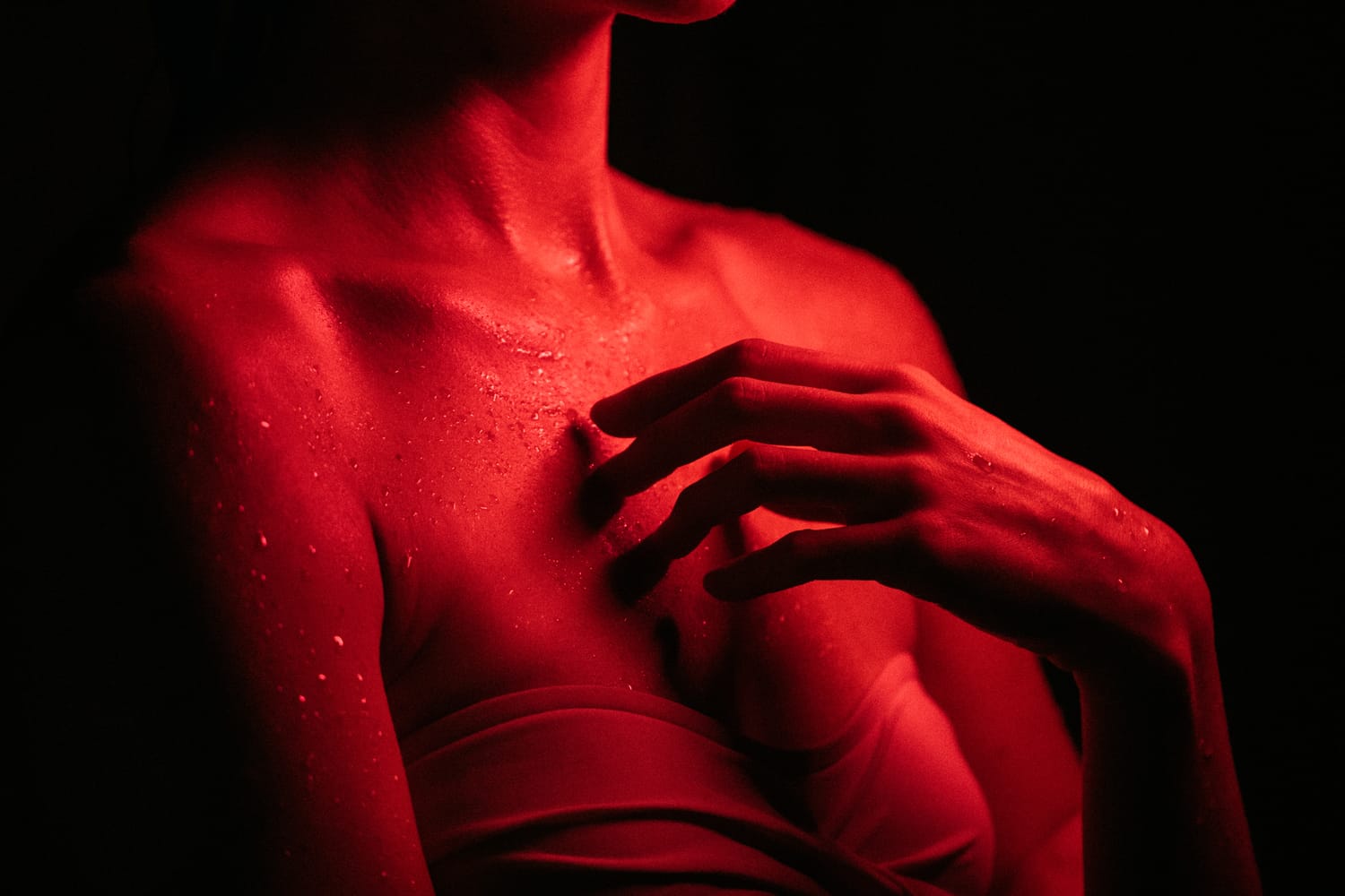 Angela at Float Space portraits story frame 24: A Float Space portrait set that moves from clean wellness headshots into red low-key portraits, skin, shadow and close detail..