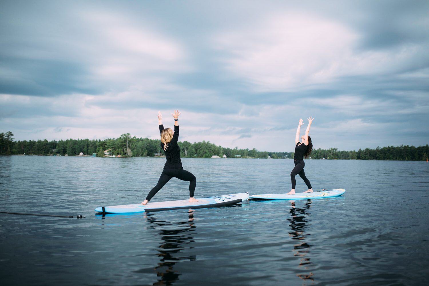 Ash and Jill, SUP Yoga corporate story frame 36: Corporate lifestyle photography for Ash and Jill on stand-up paddleboards, with yoga movement, instructor portraits and lake-based imagery for a wellness business.