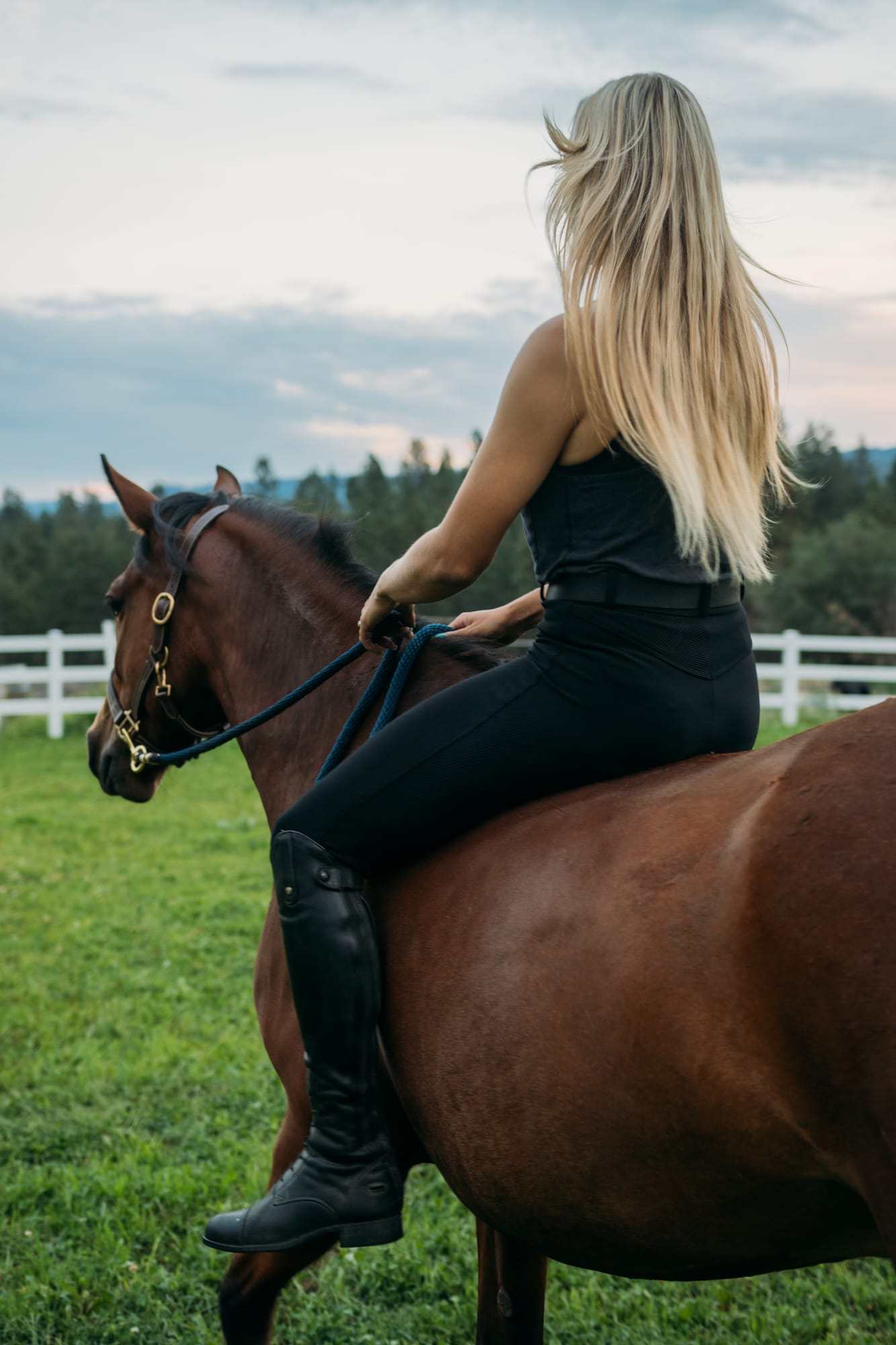 Ashton at the Ranch portraits story frame 3: Ranch portraits for Ashton in Kelowna, with horses, open pasture, quiet country styling and Okanagan light shaped into a grounded portrait story.