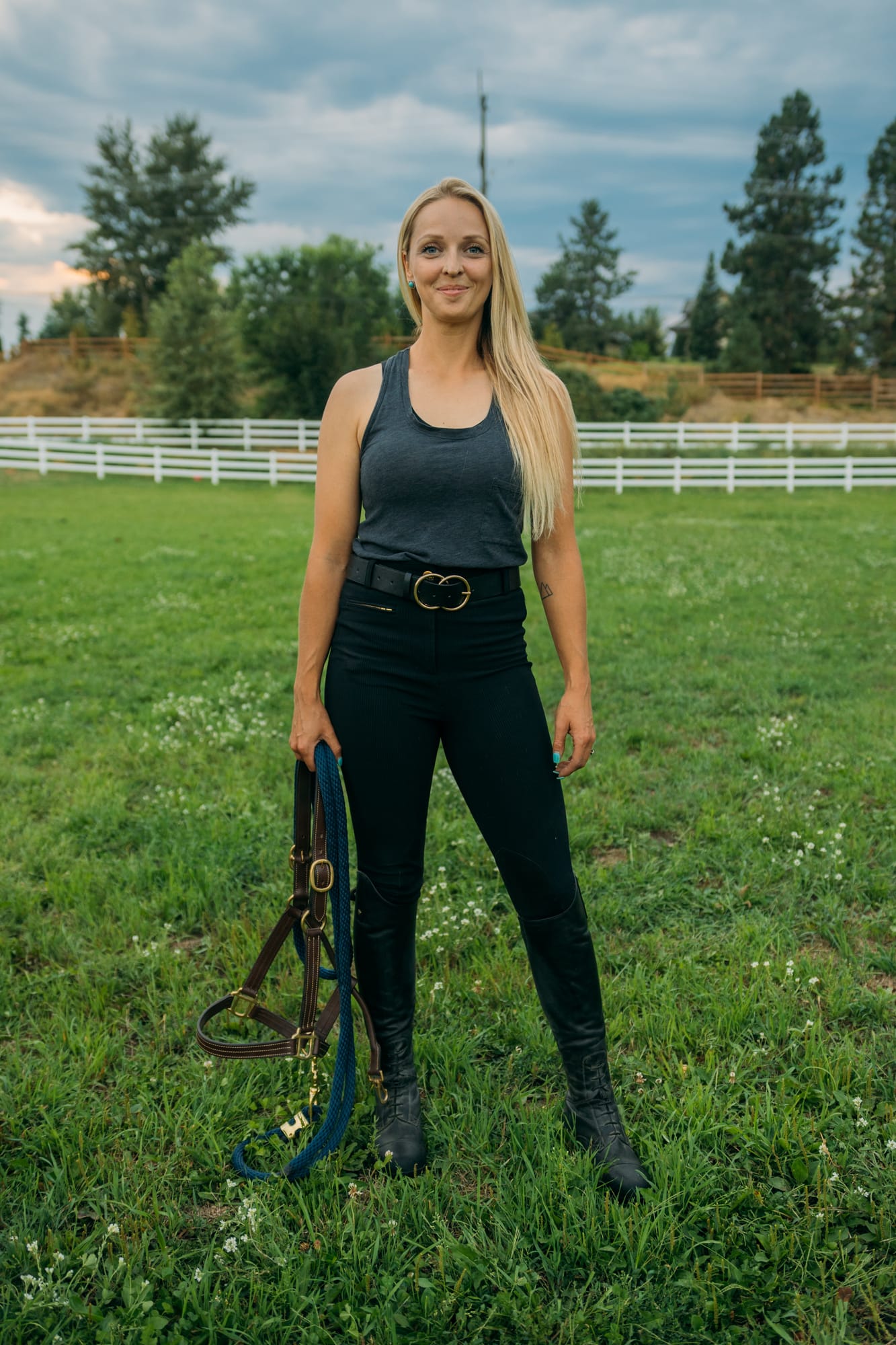 Ashton at the Ranch portraits story frame 7: Ranch portraits for Ashton in Kelowna, with horses, open pasture, quiet country styling and Okanagan light shaped into a grounded portrait story.