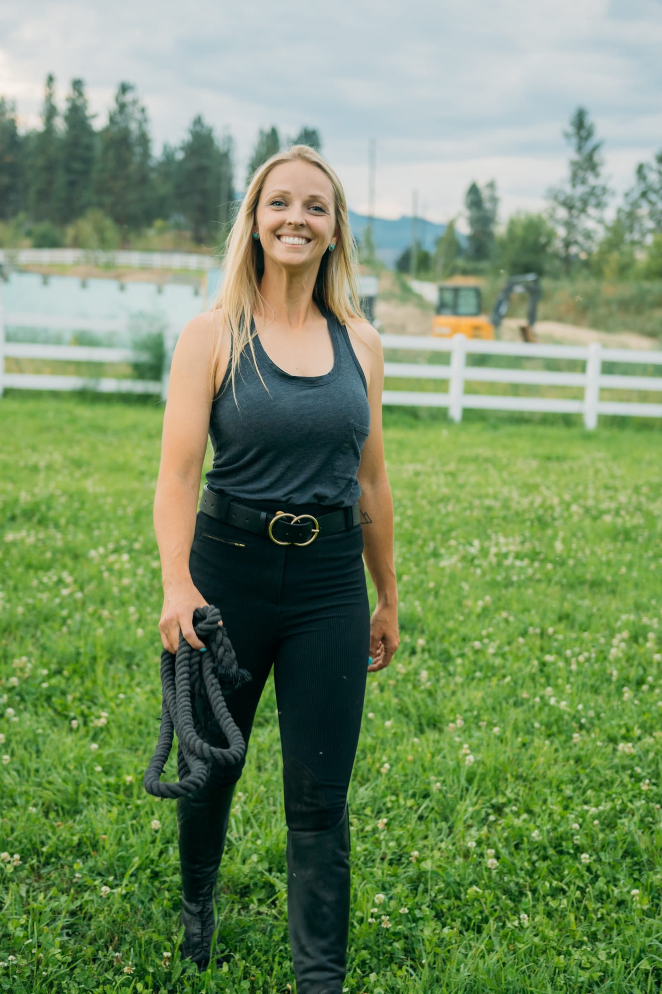 Ashton at the Ranch portraits story frame 15: Ranch portraits for Ashton in Kelowna, with horses, open pasture, quiet country styling and Okanagan light shaped into a grounded portrait story.