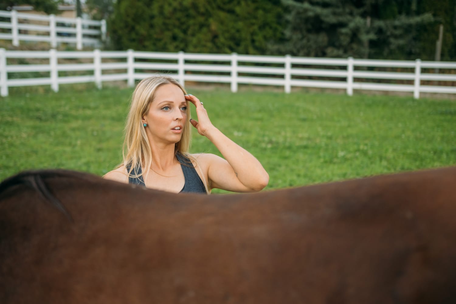 Ashton at the Ranch portraits story frame 20: Ranch portraits for Ashton in Kelowna, with horses, open pasture, quiet country styling and Okanagan light shaped into a grounded portrait story.