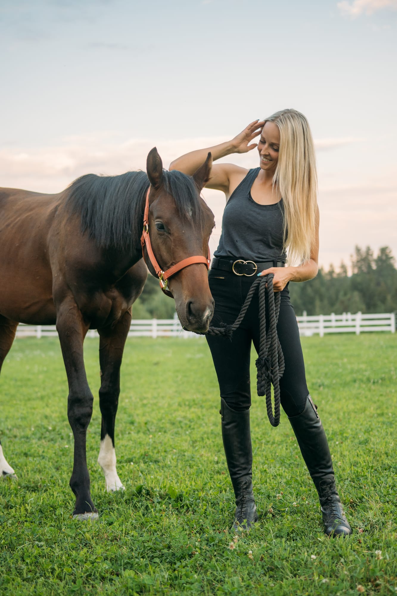 Ashton at the Ranch portraits story frame 21: Ranch portraits for Ashton in Kelowna, with horses, open pasture, quiet country styling and Okanagan light shaped into a grounded portrait story.