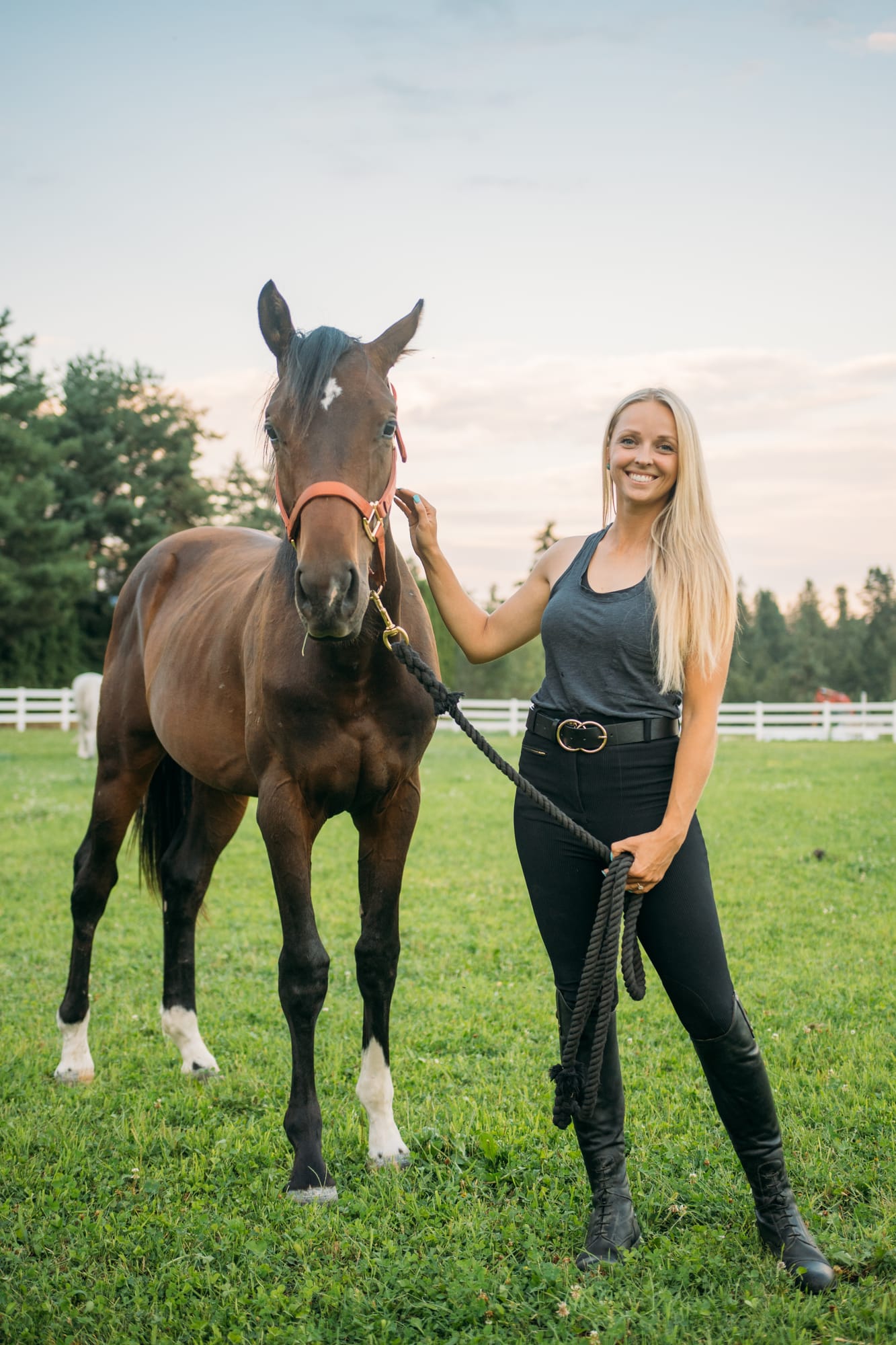 Ashton at the Ranch portraits story frame 22: Ranch portraits for Ashton in Kelowna, with horses, open pasture, quiet country styling and Okanagan light shaped into a grounded portrait story.