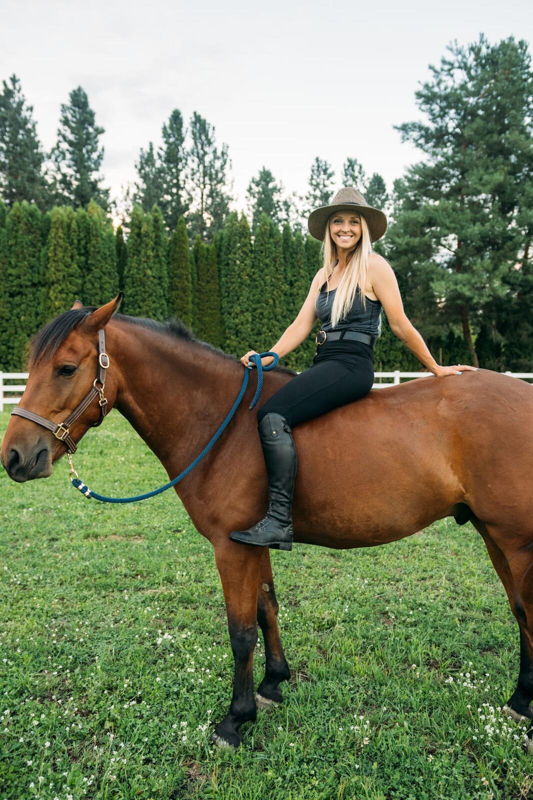 Ashton at the Ranch portraits story frame 3: Ranch portraits for Ashton in Kelowna, with horses, open pasture, quiet country styling and Okanagan light shaped into a grounded portrait story.