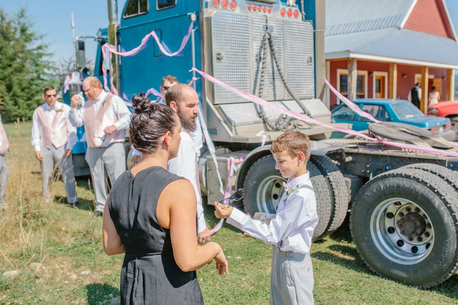 Barbara and Ryan weddings story frame 2: A Salmon Arm wedding near Mount Ida, moving from a private yard to Marine Peace Park and wharf portraits, with the groom's trucking life part of the story..