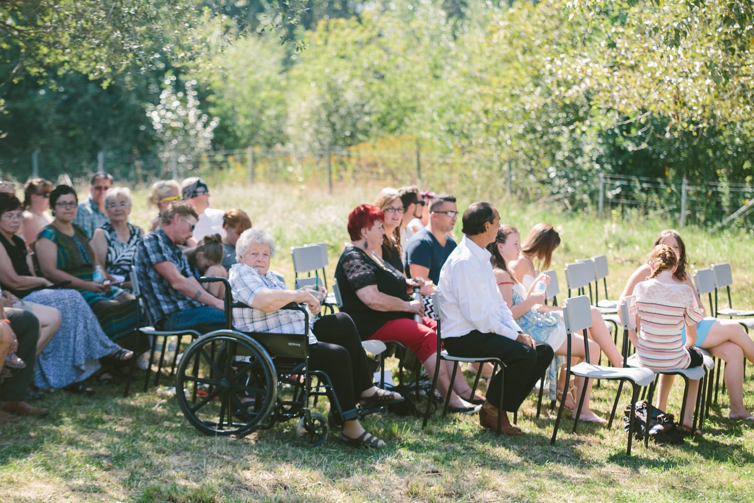 Barbara and Ryan weddings story frame 3: A Salmon Arm wedding near Mount Ida, moving from a private yard to Marine Peace Park and wharf portraits, with the groom's trucking life part of the story..
