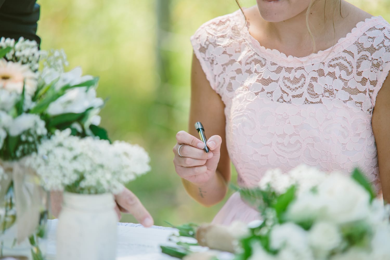 Barbara and Ryan weddings story frame 20: A Salmon Arm wedding near Mount Ida, moving from a private yard to Marine Peace Park and wharf portraits, with the groom's trucking life part of the story..