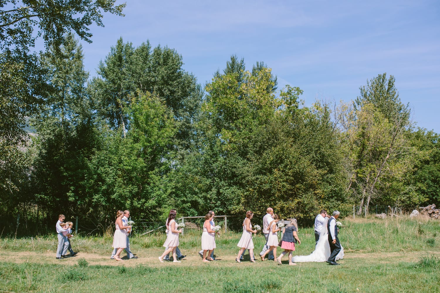 Barbara and Ryan weddings story frame 22: A Salmon Arm wedding near Mount Ida, moving from a private yard to Marine Peace Park and wharf portraits, with the groom's trucking life part of the story..