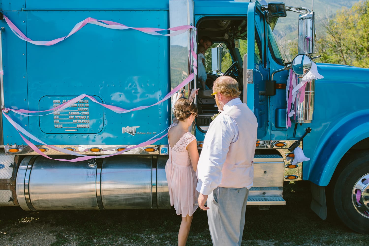 Barbara and Ryan weddings story frame 23: A Salmon Arm wedding near Mount Ida, moving from a private yard to Marine Peace Park and wharf portraits, with the groom's trucking life part of the story..
