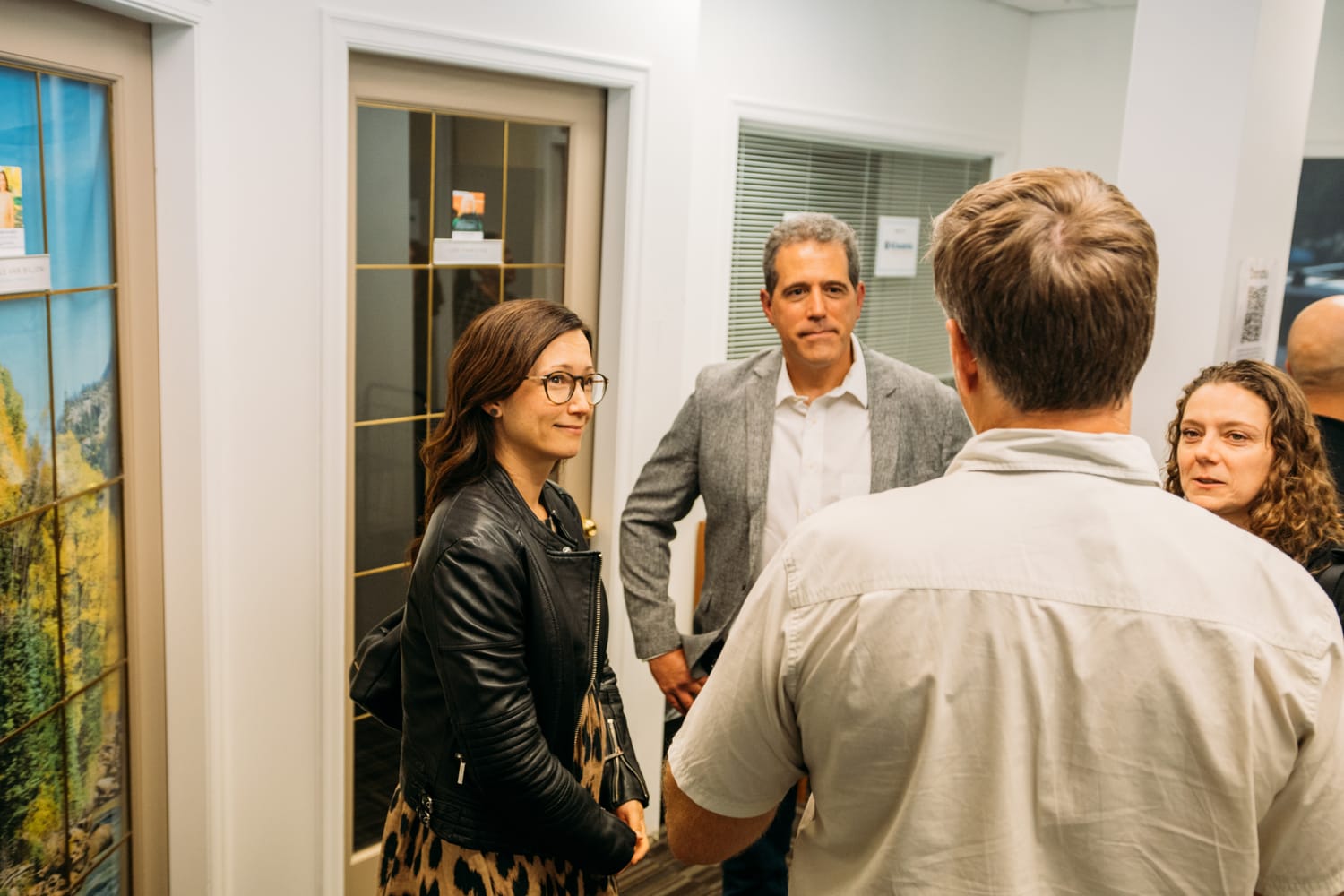 BrainTrust Canada Grand Opening corporate story frame 15: Event photography for BrainTrust Canada's Kelowna grand opening, with ribbon cutting, guests, office details, local food and exterior images for community and nonprofit communications..