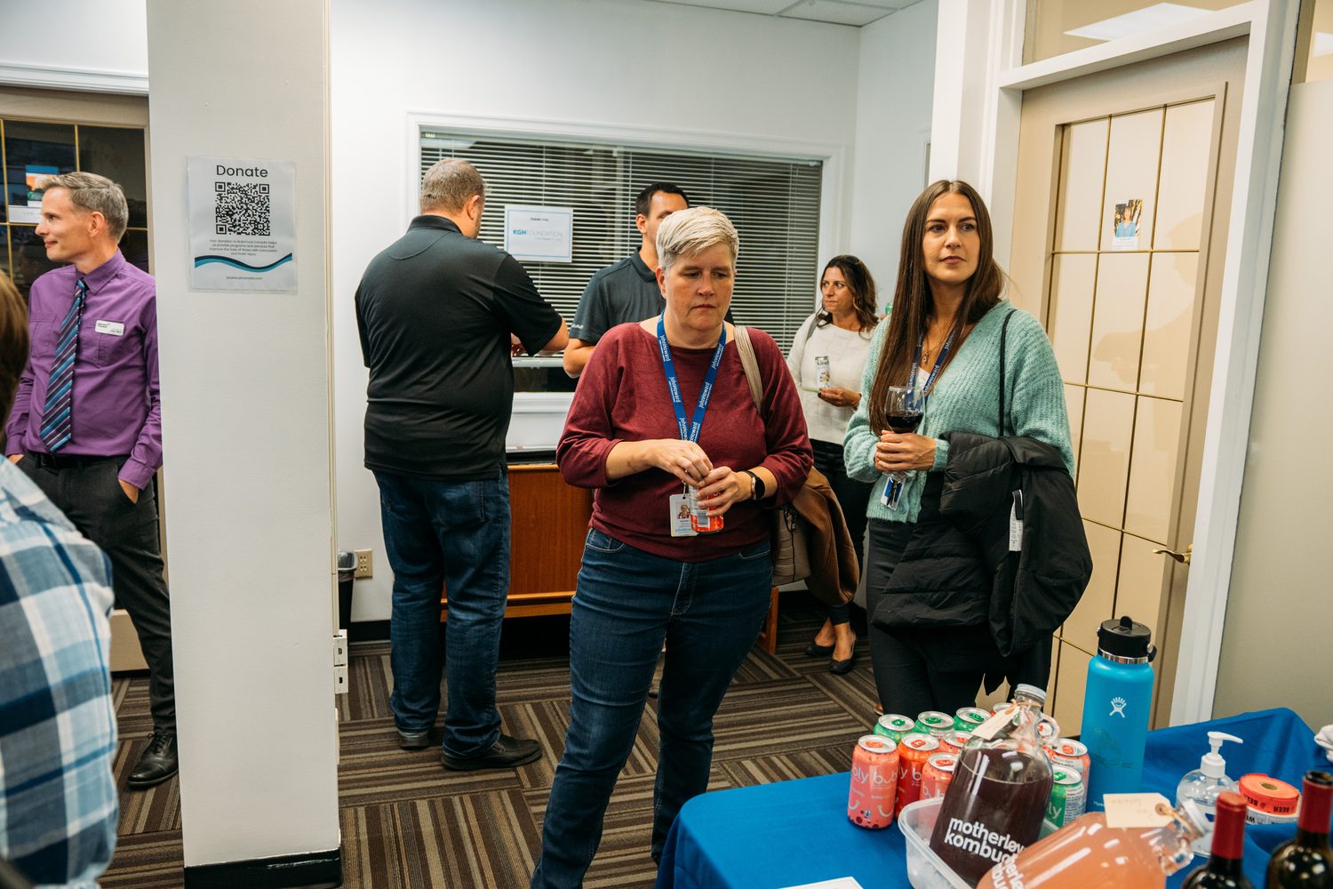 BrainTrust Canada Grand Opening corporate story frame 24: Event photography for BrainTrust Canada's Kelowna grand opening, with ribbon cutting, guests, office details, local food and exterior images for community and nonprofit communications..