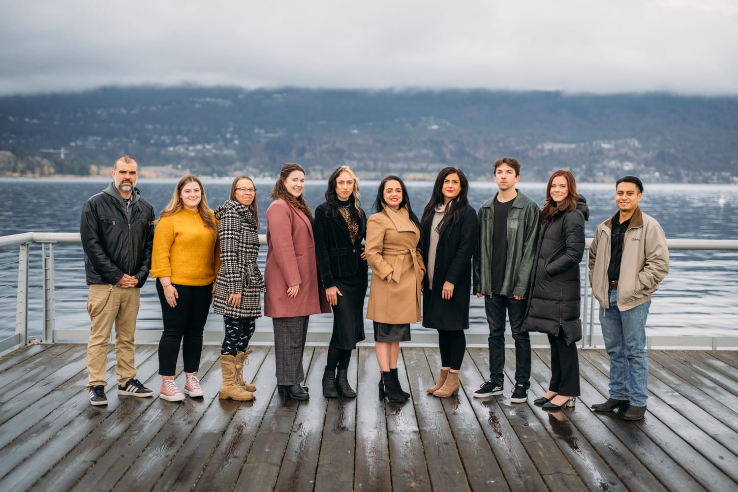 BrainTrust Canada Waterfront corporate story frame 1: Waterfront team and brand portraits for BrainTrust Canada in Kelowna, built around group photos, walking images and approachable nonprofit profile photography..