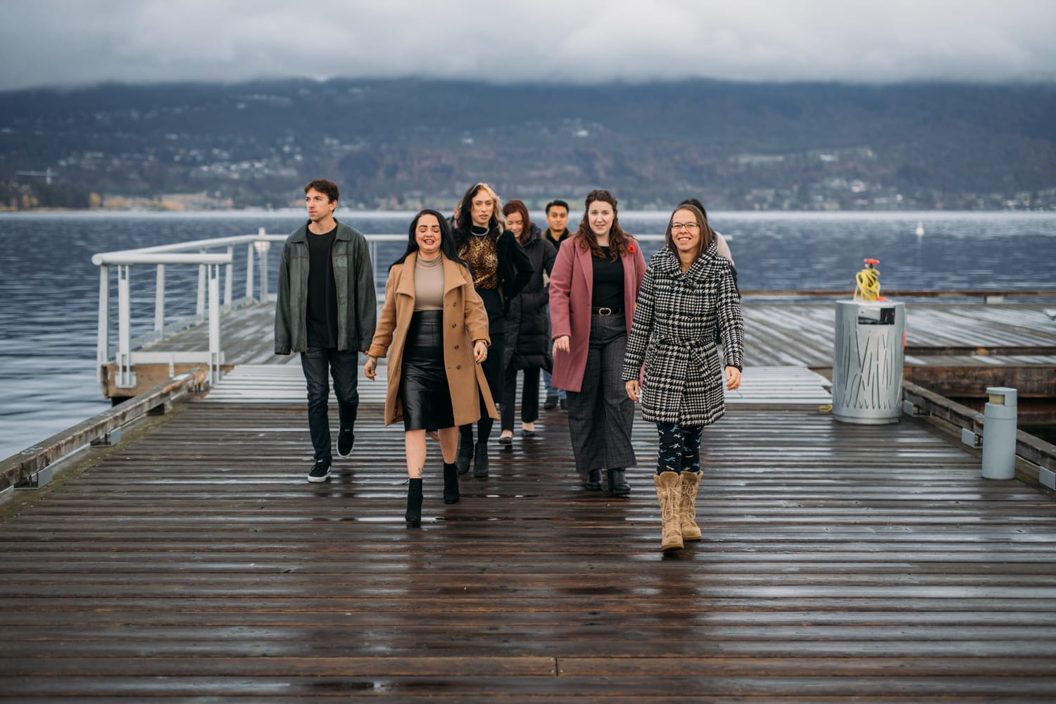 BrainTrust Canada Waterfront corporate story frame 9: Waterfront team and brand portraits for BrainTrust Canada in Kelowna, built around group photos, walking images and approachable nonprofit profile photography..