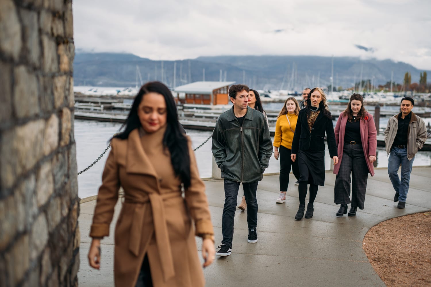 BrainTrust Canada Waterfront corporate story frame 17: Waterfront team and brand portraits for BrainTrust Canada in Kelowna, built around group photos, walking images and approachable nonprofit profile photography..