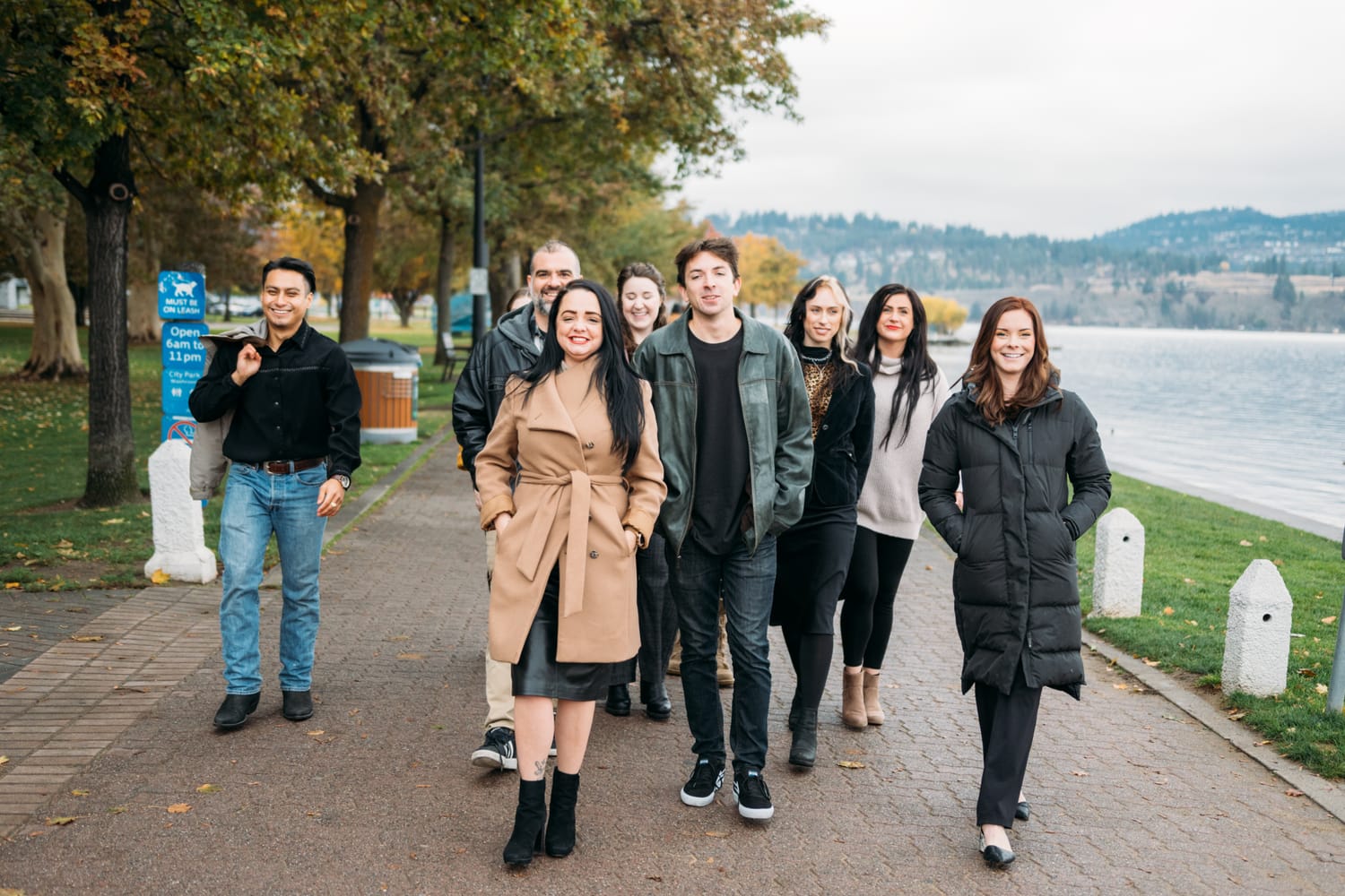 BrainTrust Canada Waterfront corporate story frame 19: Waterfront team and brand portraits for BrainTrust Canada in Kelowna, built around group photos, walking images and approachable nonprofit profile photography..