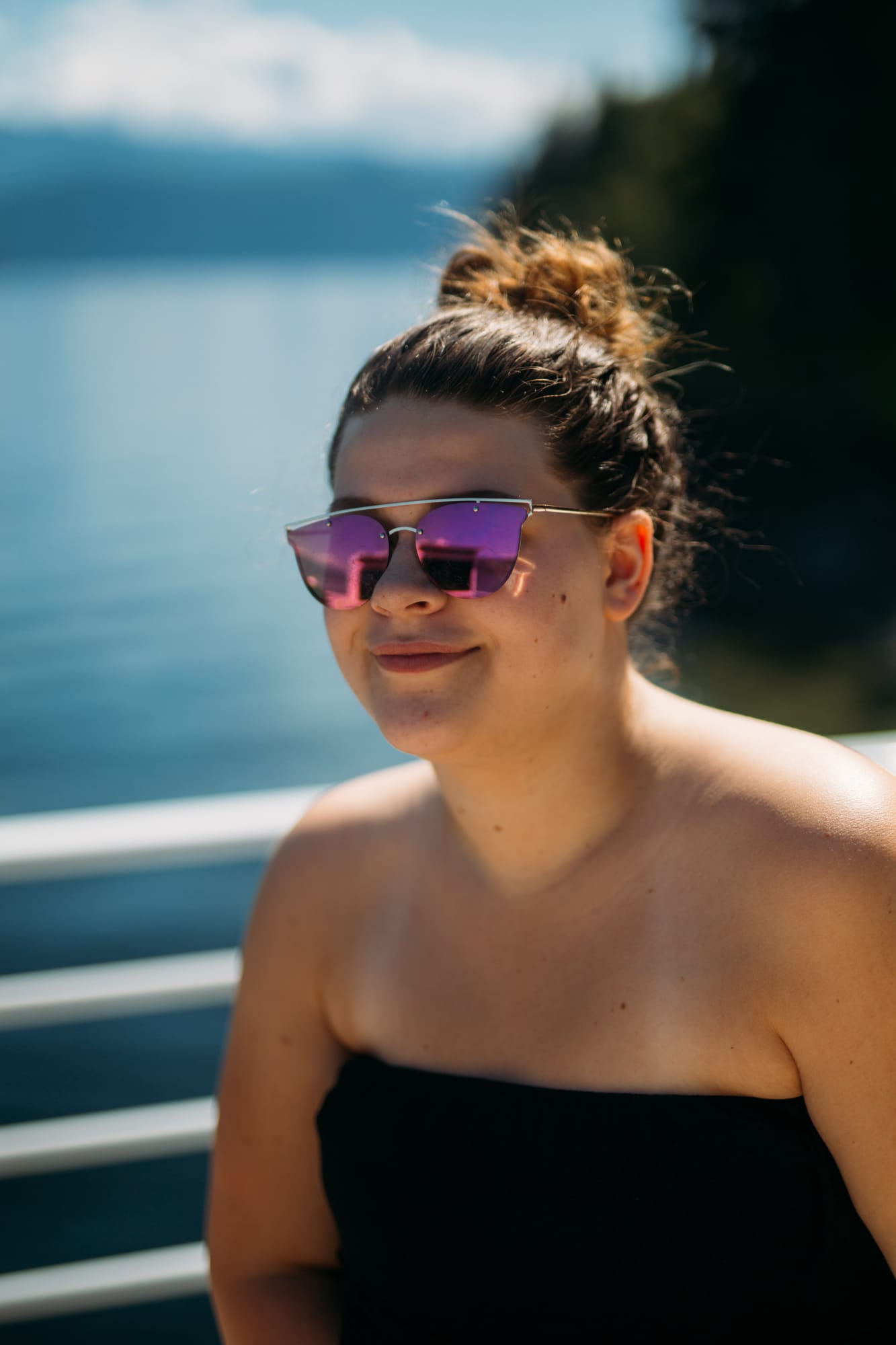 Carmel and Chris weddings story frame 4: A Sicamous and Shuswap Lake houseboat wedding that moved from water to beach, with friend-community overlap and a relaxed lakeside feeling..