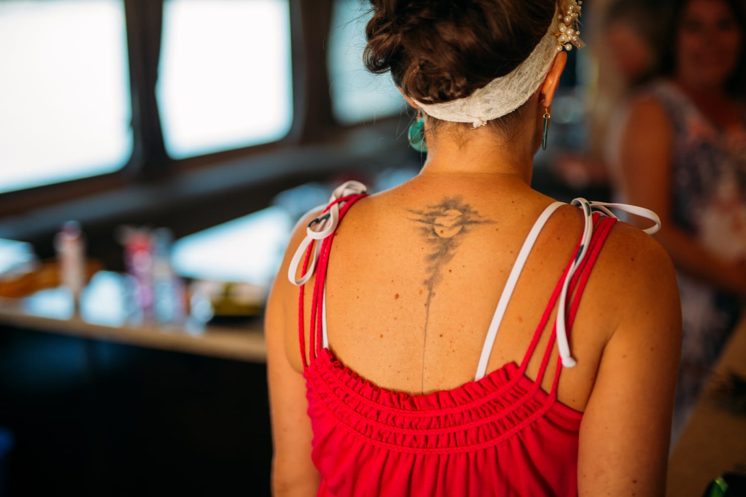 Carmel and Chris weddings story frame 10: A Sicamous and Shuswap Lake houseboat wedding that moved from water to beach, with friend-community overlap and a relaxed lakeside feeling..