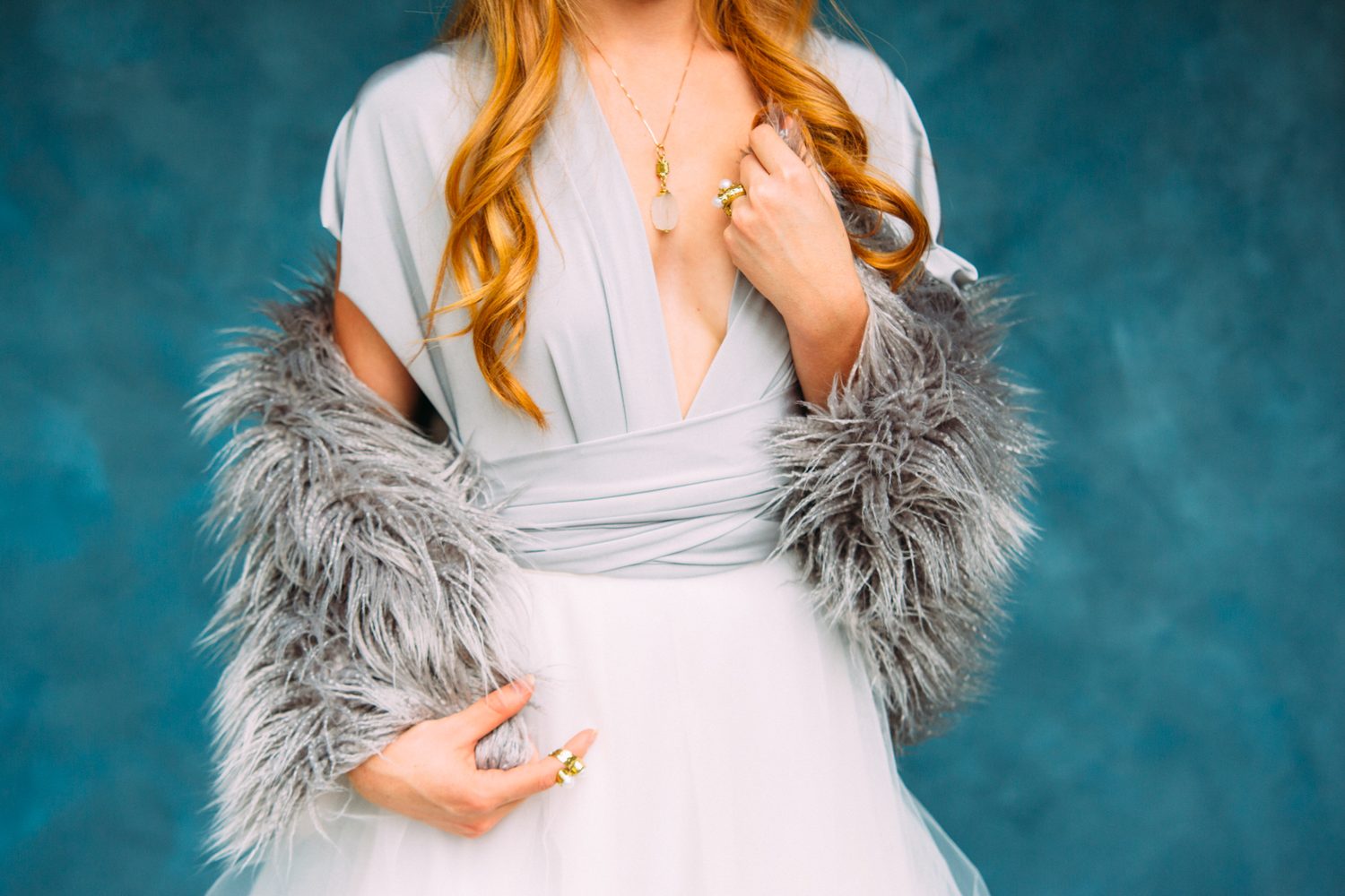 Catherine portraits story frame 9: Fashion portraits with Catherine from a White Willow Photography-designed collaboration near Salmon Arm, with pale blue styling, jewellery, veil and a painted studio backdrop.