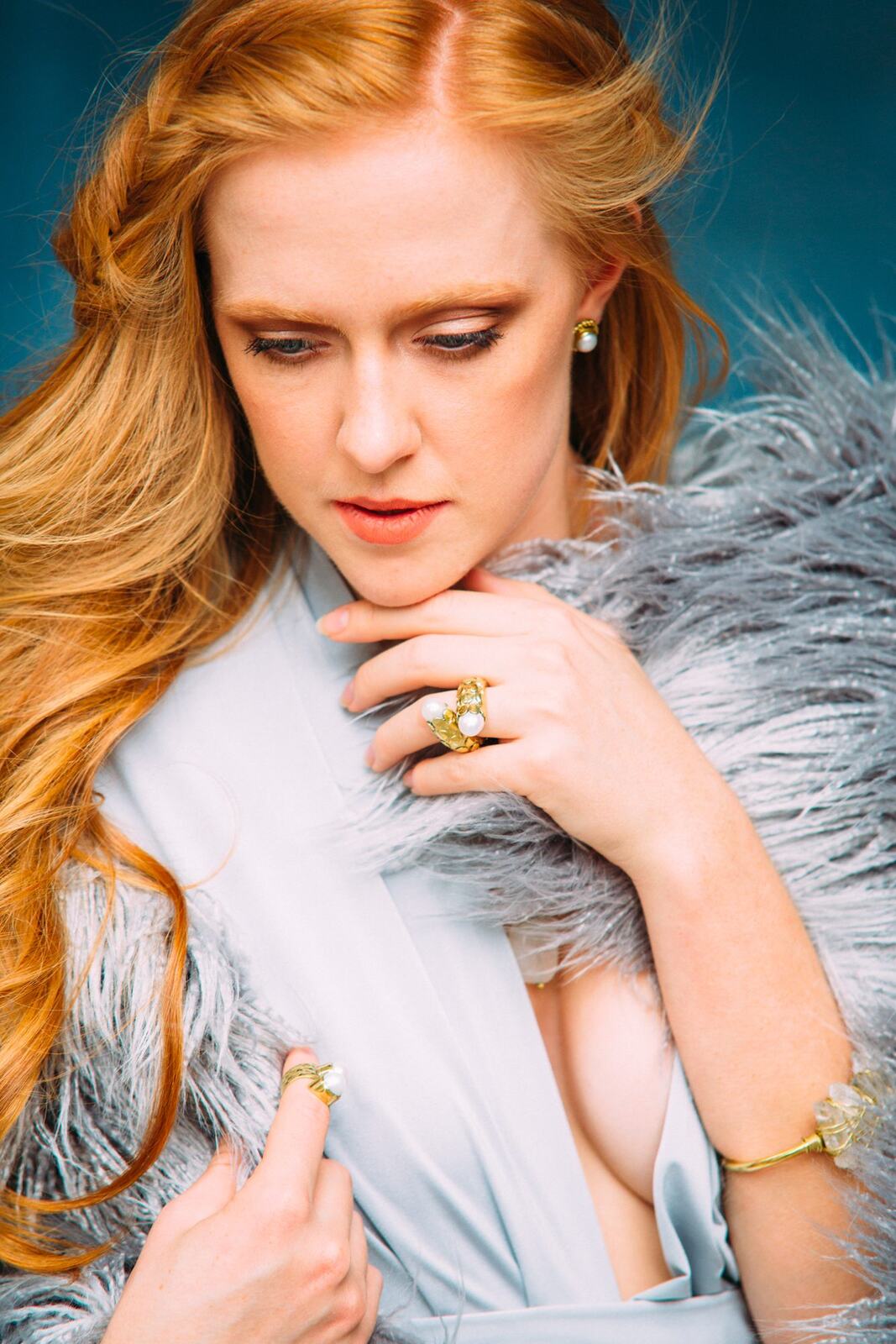 Catherine portraits story frame 12: Fashion portraits with Catherine from a White Willow Photography-designed collaboration near Salmon Arm, with pale blue styling, jewellery, veil and a painted studio backdrop.