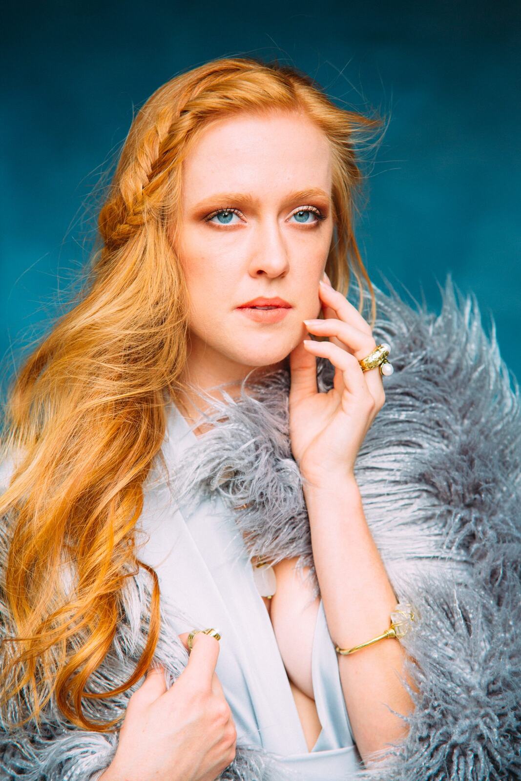 Catherine portraits story frame 14: Fashion portraits with Catherine from a White Willow Photography-designed collaboration near Salmon Arm, with pale blue styling, jewellery, veil and a painted studio backdrop.