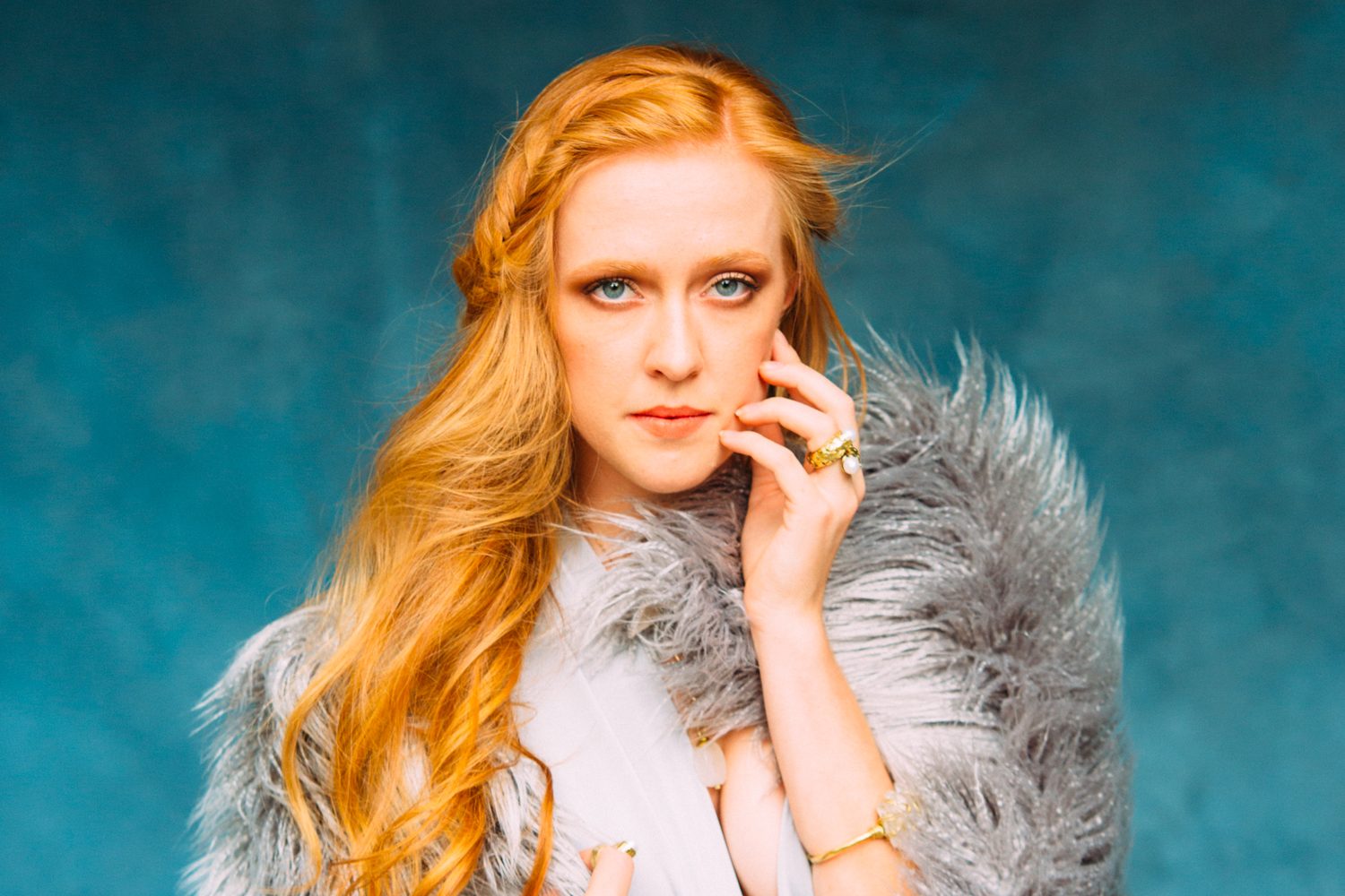 Catherine portraits story frame 15: Fashion portraits with Catherine from a White Willow Photography-designed collaboration near Salmon Arm, with pale blue styling, jewellery, veil and a painted studio backdrop.