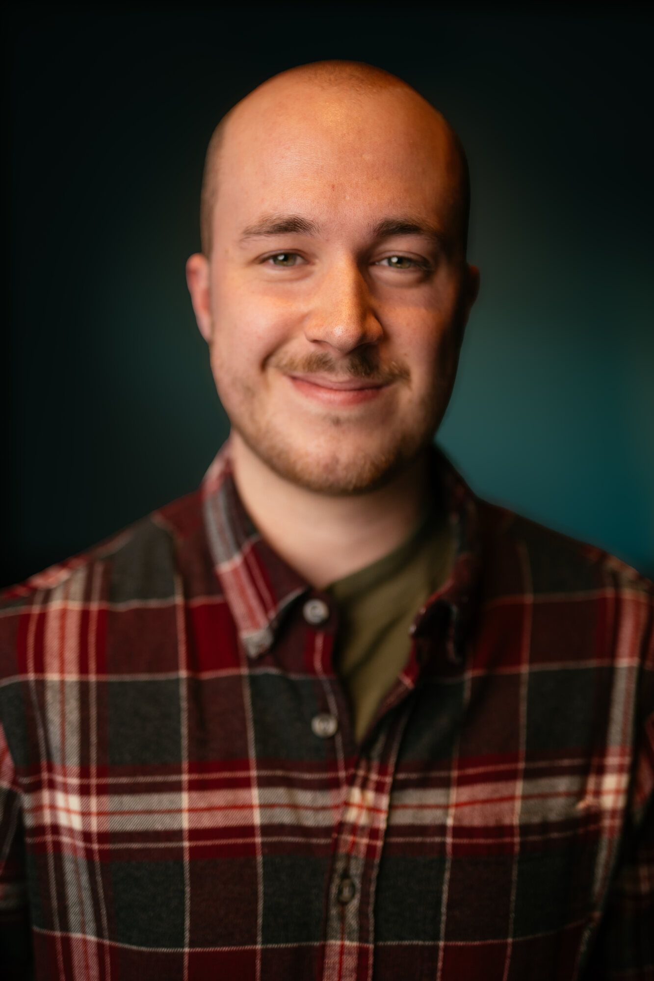 CATO Headshots actor portrait in plaid shirt