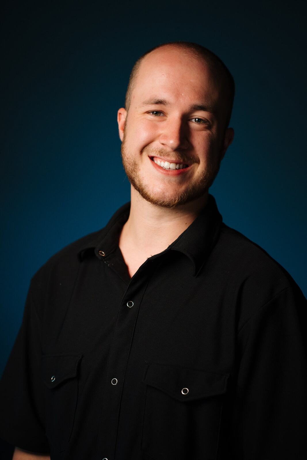 CATO Redux actor headshot on blue, photograph 11