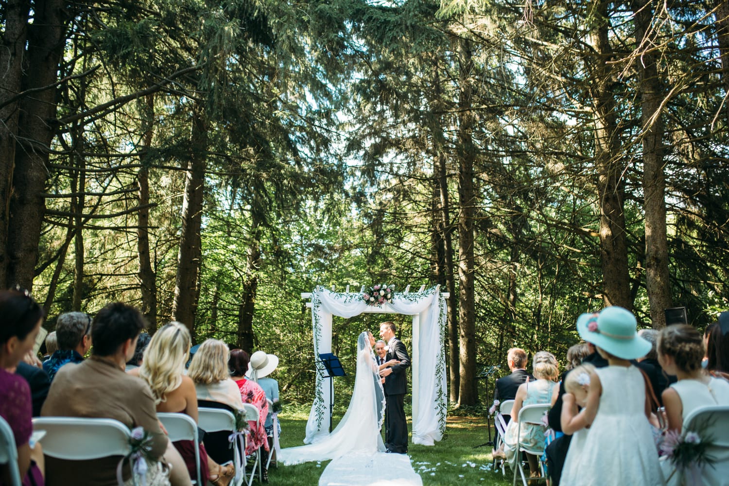 Ciara and Mikie weddings story frame 15: An Ontario wedding near Peterborough, with archive clues pointing to Trent University or Elmhirst Resort and a full reception-to-after-party story..