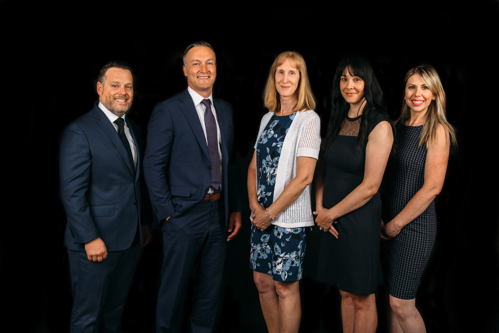 Corporate team photography on a dark studio backdrop