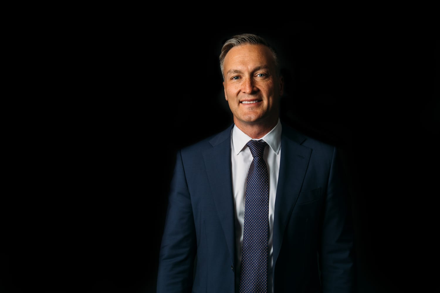 Bird Moore corporate story frame 2: Dark-background business portraits and billboard proof for Bird Moore in Kelowna, with profile imagery built for financial, advisory and local campaign use..