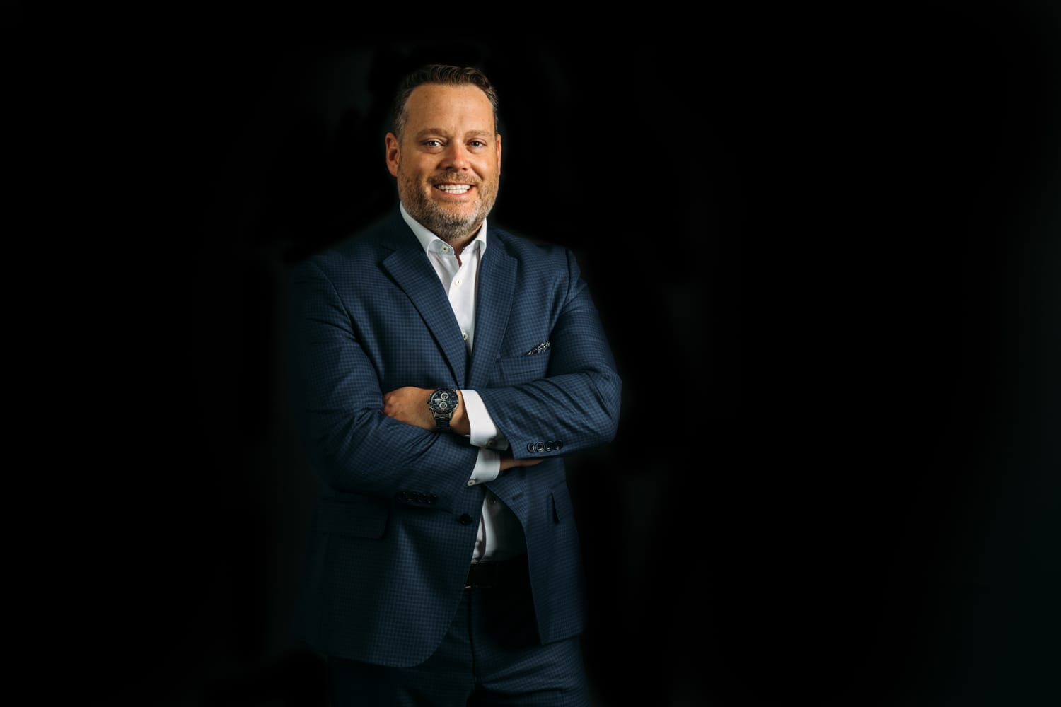 Bird Moore corporate story frame 4: Dark-background business portraits and billboard proof for Bird Moore in Kelowna, with profile imagery built for financial, advisory and local campaign use..