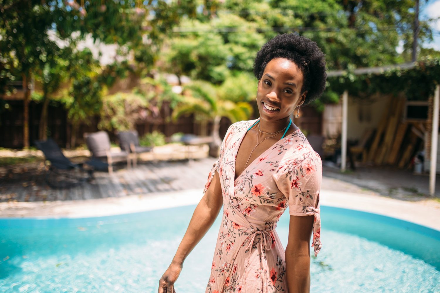 Dee-J by the Pool in Miami portraits story frame 2: Poolside portraits with Dee-J Spaulding in Miami, moving through direct expression, swimwear details, bright water and warm Florida light.