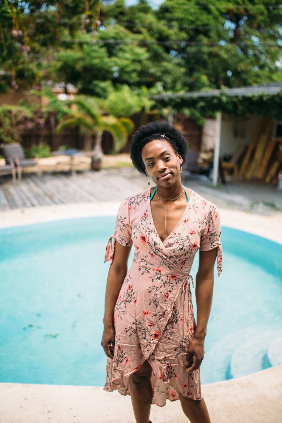 Dee-J by the Pool in Miami portraits story frame 1: Poolside portraits with Dee-J Spaulding in Miami, moving through direct expression, swimwear details, bright water and warm Florida light.