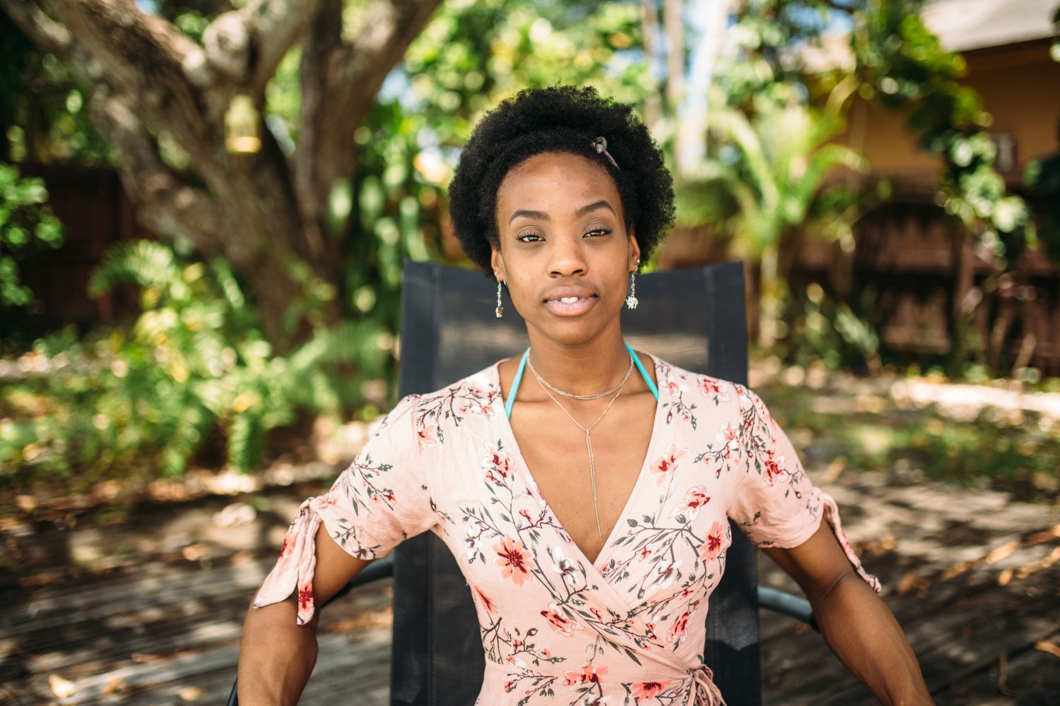 Dee-J by the Pool in Miami portraits story frame 15: Poolside portraits with Dee-J Spaulding in Miami, moving through direct expression, swimwear details, bright water and warm Florida light.